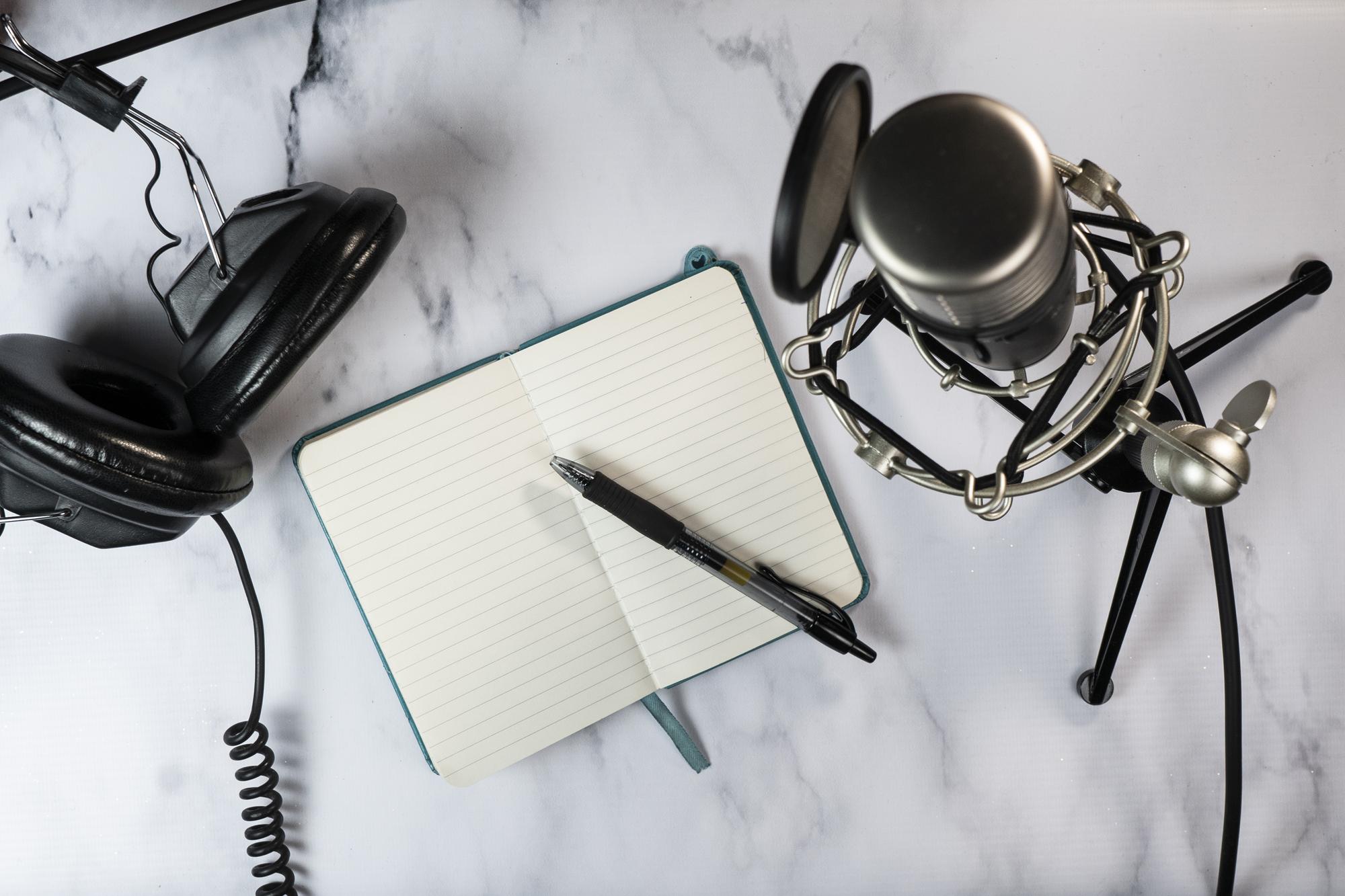 Studio microphone and headphones on desk